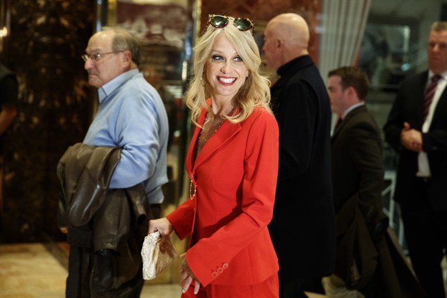 Kellyanne Conway walks past reporters in the lobby of Trump Tower, Monday, Nov. 28, 2016, in New York.