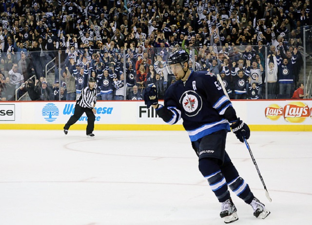 Mark Scheifele of the Winnipeg Jets celebrates after scoring the game winning shootout goal against the Los Angeles Kings at the MTS Centre on November 13, 2016.