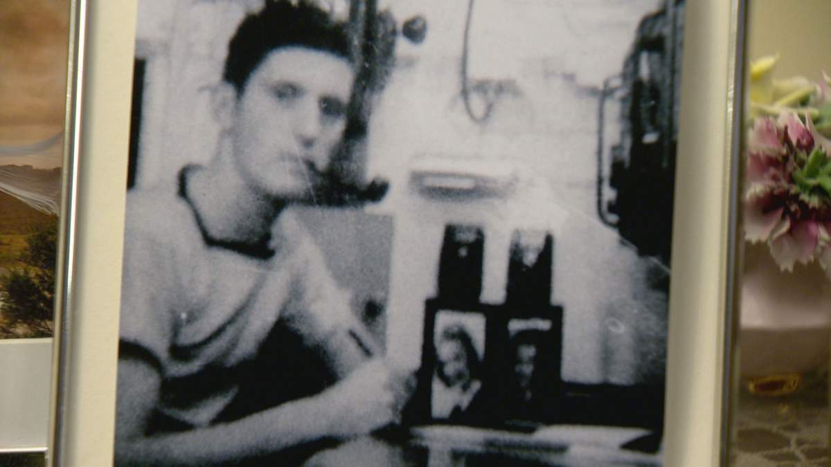 Roland McGuigan on board a Navy ship in 1941. A photo of his now wife, Betty McGuigan, on his desk.