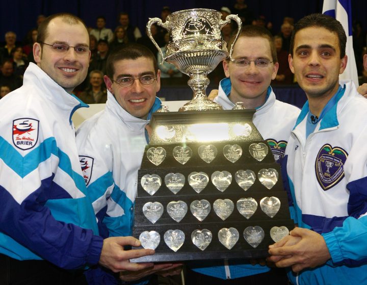 Team Quebec (left to right) skip Jean-Michel Menard, third Francois Roberge, second Eric Sylvain and lead Maxime Elmaleh hold the trophy after winning the Canadian Men's Curling championship in Regina, Saskatchewan on Sunday March 19, 2006.