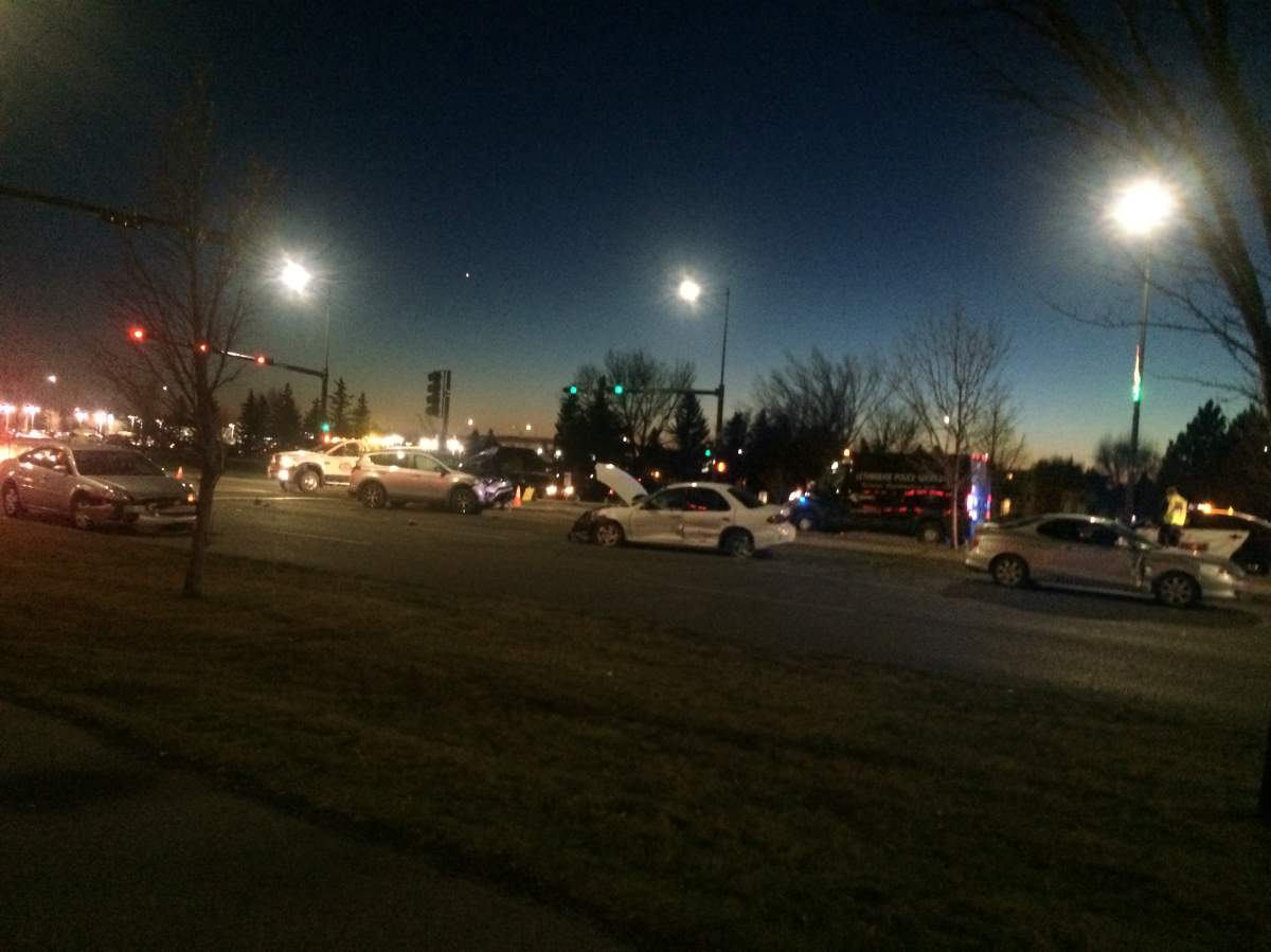 Police allege a Lethbridge woman was evading arrest when she hit a police officer and seven other vehicles Tuesday night.