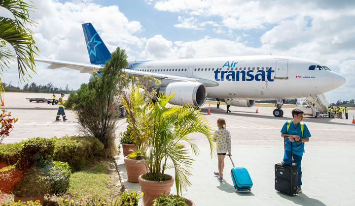 Passengers getting ready to board an airplane in Cuba