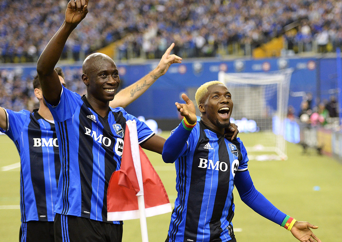Montreal Impact defender Ambroise Oyongo (2), right, celebrates his goal against Toronto FC with teammate Hassoun Camara (6) during second half action in the first leg of the MLS Eastern Conference final at the Olympic Stadium in Montreal, Tuesday, November 22, 2016. 
