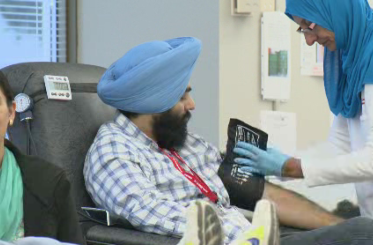 A man donates blood during the 17th annual Sikh Nation blood drive in Surrey, B.C. on Nov. 12, 2016. 