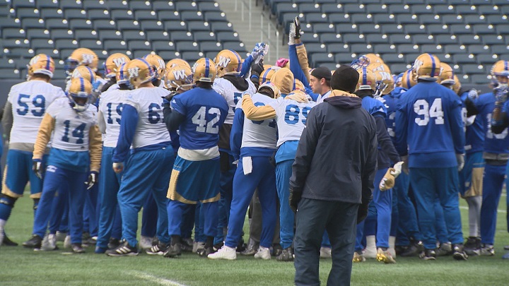The Winnipeg Blue Bombers gather at centre field during practice on Tuesday.