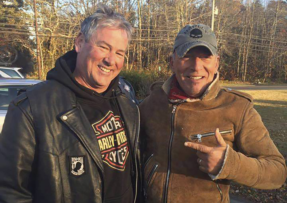 In this Friday, Nov. 11, 2016, photo provided by Ryan Bailey, Dan Barkalow, left, and Bruce Springsteen poses for a photo in Wall Township, N.J. Barkalow and a group from the Freehold American Legion was riding after a Veterans Day event Friday when they pulled over to help a stranded motorcyclist who turned out to be The Boss.