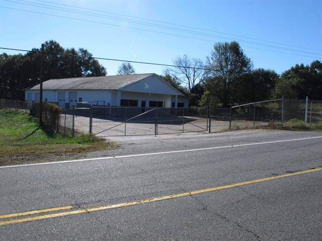 In this Oct. 24, 2013 file photo, the building that once housed Superbike Motorsports sits empty in Chesnee, S.C. The building has been abandoned since four people who worked in the shop were shot to death in Nov. 2003.