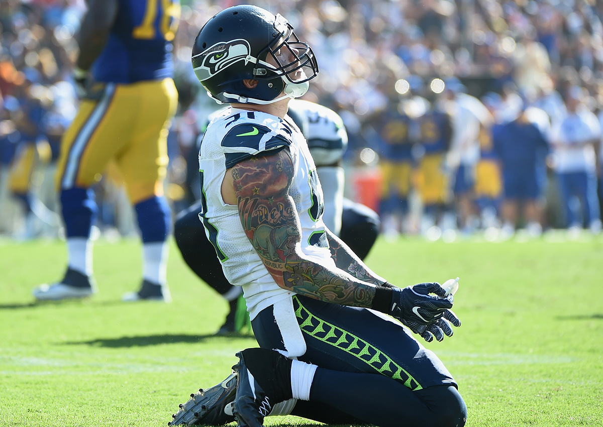 Cassius Marsh of the Seattle Seahawks reacts to a face mask call on his sack during the fourth quarter of the home opening NFL game against the Los Angeles Rams at Los Angeles Coliseum on September 18, 2016 in Los Angeles, California.