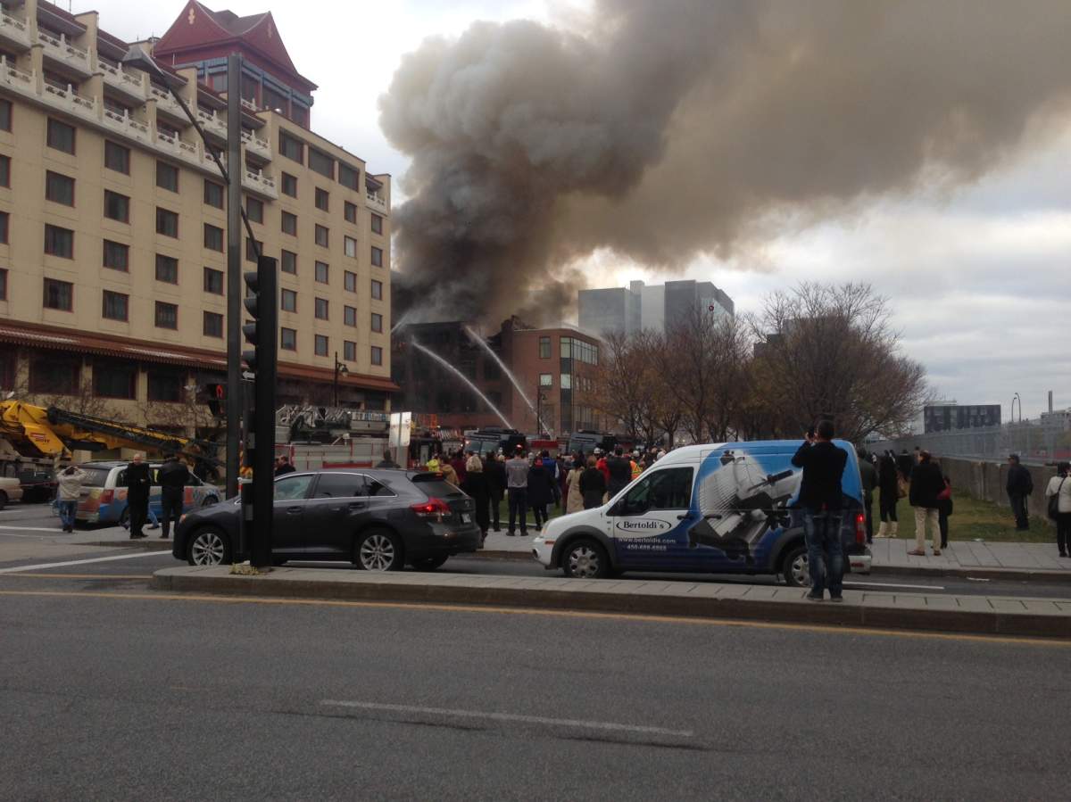 Firefighters battle a blaze in a building in Montreal's Chinatown, Thursday, November 17, 2016.