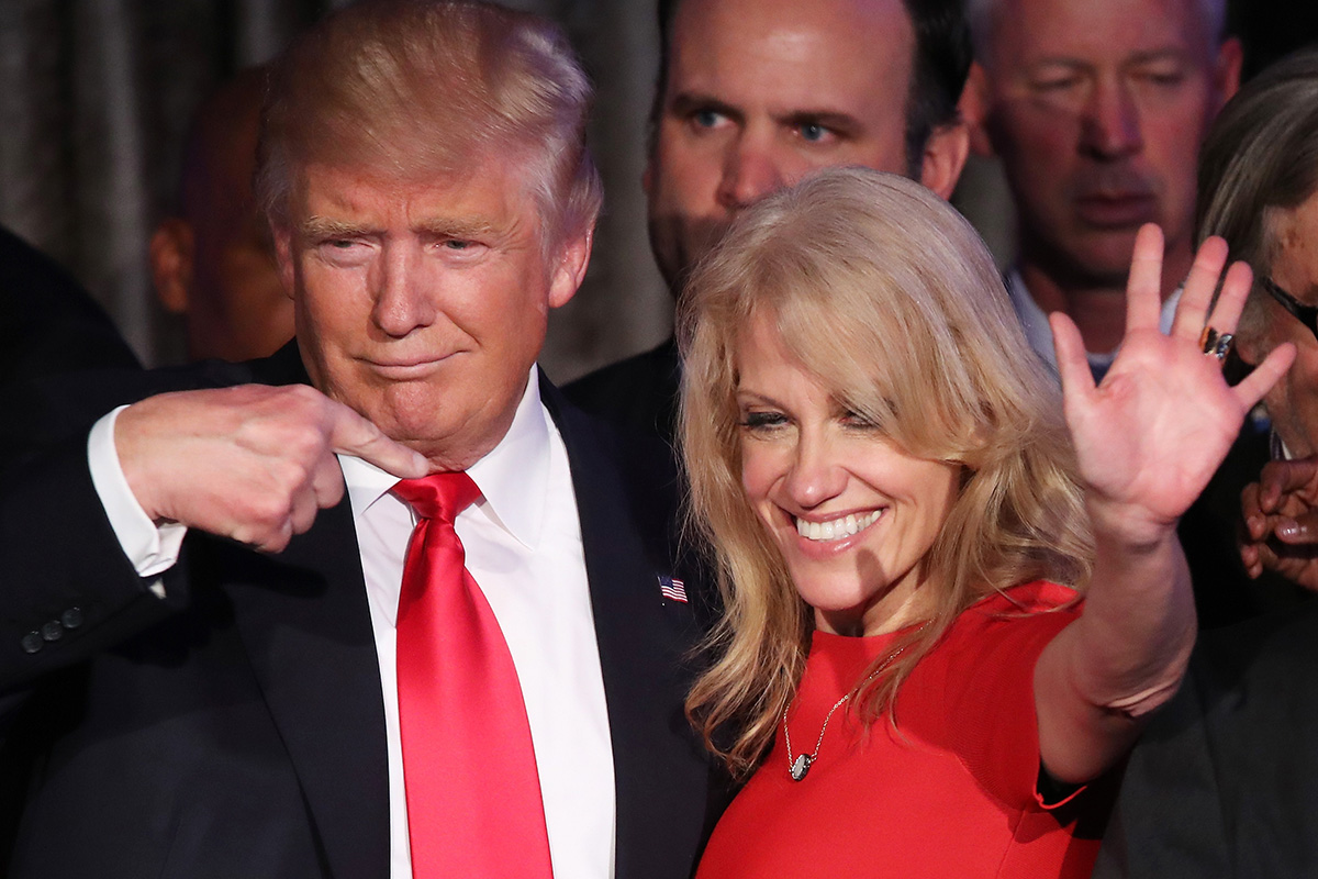 Republican president-elect Donald Trump along with his campaign manager Kellyanne Conway acknowledge the crowd during his election night event at the New York Hilton Midtown in the early morning hours of November 9, 2016 in New York City.