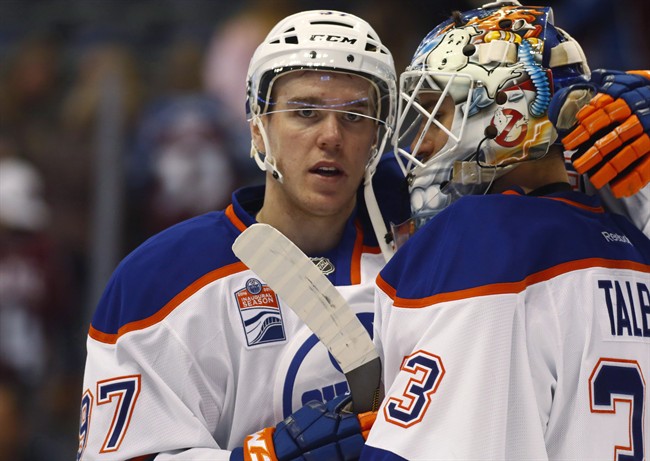 Edmonton Oilers center Connor McDavid, left, congratulates goalie Cam Talbot after the Oilers defeated the Colorado Avalanche in an NHL hockey game in Denver on Nov. 23, 2016. During a Thursday morning conference call, Edmonton Oilers general manager Peter Chiarelli and his scouts broke down the team's progress from last season. "And there was improvement in every area," Chiarelli said. Progress has been unmistakable for the Pacific Division leaders, even during a recent five-game losing streak which saw them win the puck possession battle handily four times. 