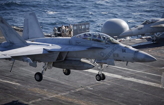 A U.S. Navy F/A-18 Super Hornet fighter lands onto the deck of the USS Ronald Reagan during a joint naval drill between South Korea and the U.S. in the West Sea, South Korea, Wednesday, Oct. 28, 2015. 
