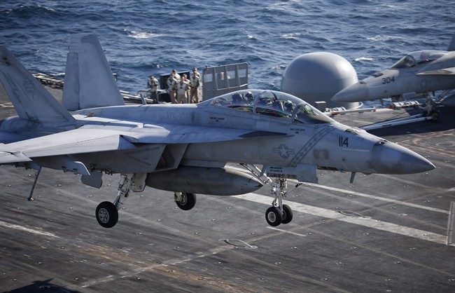 A U.S. Navy F/A-18 Super Hornet fighter lands onto the deck of the USS Ronald Reagan during a joint naval drill between South Korea and the U.S. in the West Sea, South Korea, Oct. 28, 2015. 