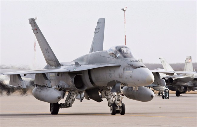 A pilot positions a CF-18 Hornet at the CFB Cold Lake, in Cold Lake, Alberta on Tuesday, October 21, 2014.