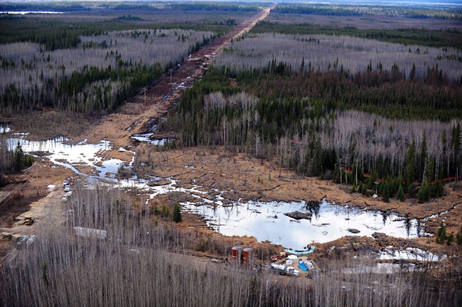 Crude oil is shown at the site of a pipeline break northeast of Peace River, Alta., on May 4, 2011.