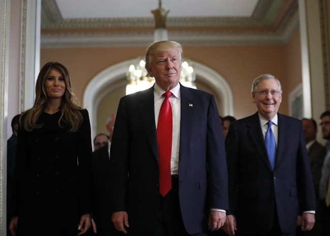 President-elect Donald Trump and his wife Melania walk with Senate Majority Leader Mitch McConnell of Ky. after a meeting on Capitol Hill on Nov. 10, 2016.