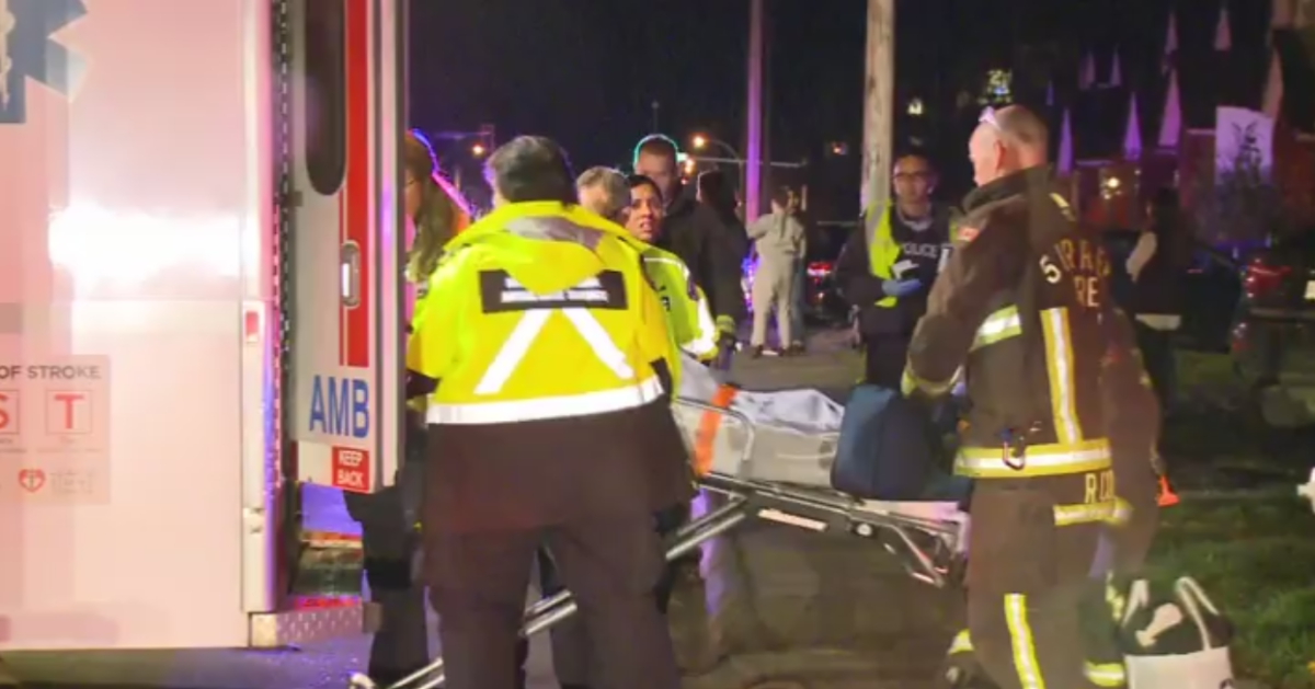 Family of three struck by vehicle while crossing road in Surrey - image