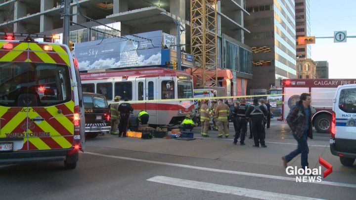 Man in life-threatening condition after being trapped under Calgary ...