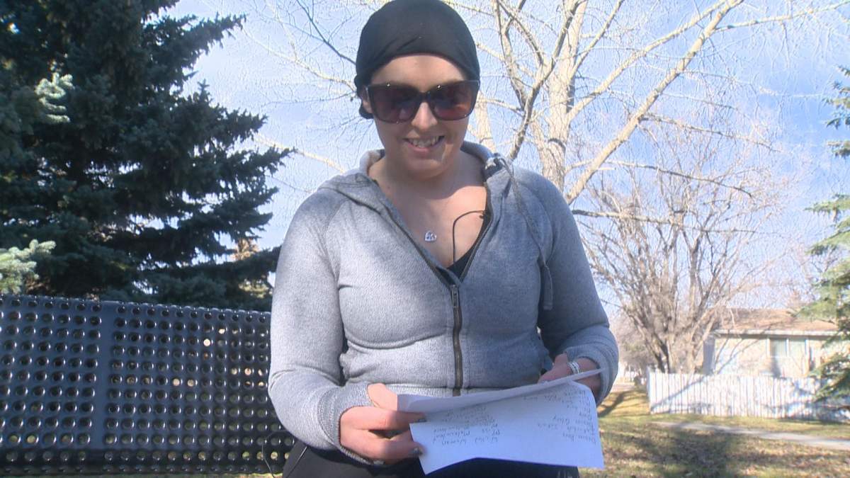 Desiree Gory reads a letter sent to her by her fiance when they were both in jail.