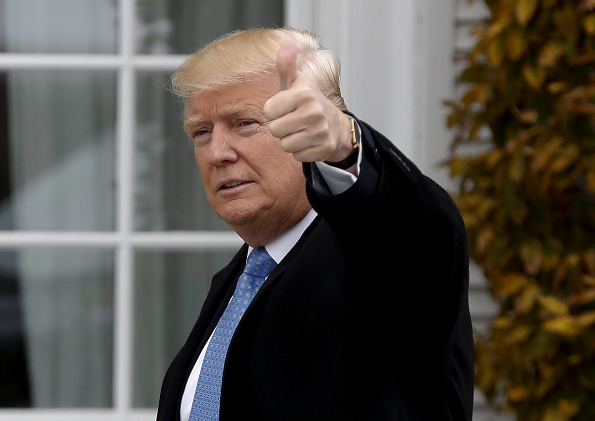 President-elect Donald Trump gives the thumbs up as he arrives at the Trump National Golf Club Bedminster clubhouse, Sunday, Nov. 20, 2016 in Bedminster, N.J.. 