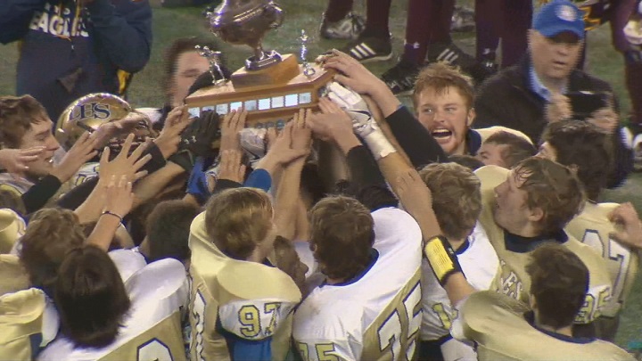 The Dryden Eagles celebrate their victory over the Portage Trojans in the Canad Inns Bowl.