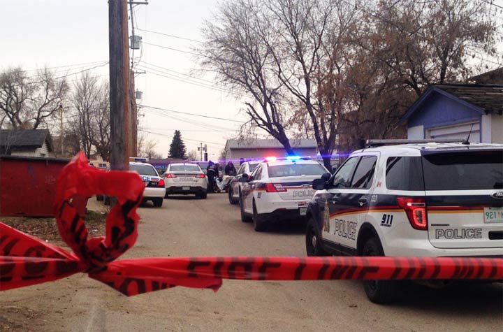 Members of police, MD Ambulance and the Saskatoon Fire Department on scene in the alley behind Avenue O South Saturday morning where a car hit a power pole.