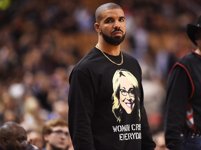 Rapper Drake watches second half NBA basketball action between the Golden State Warriors and Toronto Raptors in Toronto on Wednesday, November 16, 2016.