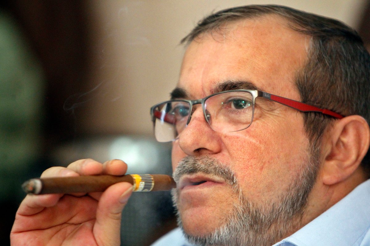 Rodrigo Londono smokes a cigar while waiting for the final count of votes of the plebiscite held in Colombia on October 02, 2016 in Havana, Cuba.