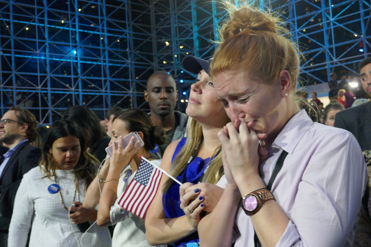 NEW YORK, UNITED STATES - NOVEMBER 09: Democratic Party's presidential nominee Hillary Clinton's supporters show their sorrow as the results indicate the Republican Party's presidential nominee Donald Trump's victory for the 2016 Presidential Elections at Jacob K. Javits Convention Center in New York, NY, USA on November 9, 2016. Republican nominee Donald Trump won victory against Democratic challenger Hillary Clinton on US presidential election. 