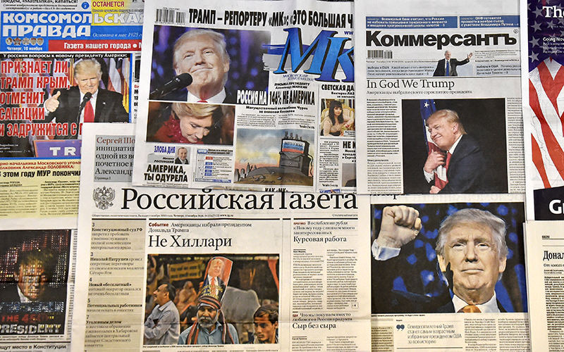 This photo illustration taken in Moscow on November 10, 2016 shows front pages of Russian newspapers reporting on the victory of Donald Trump in the US presidential election. 