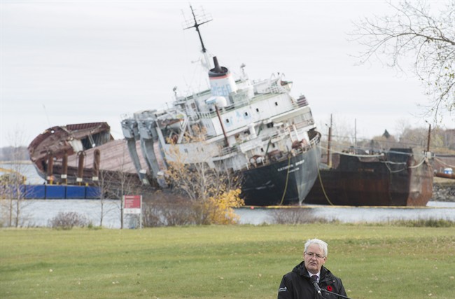 Federal Transport minister Marc Garneau speaks at a news conference next to the abandoned cargo ship Kathryn Spirit near Montreal, Thursday, November 10, 2016. 