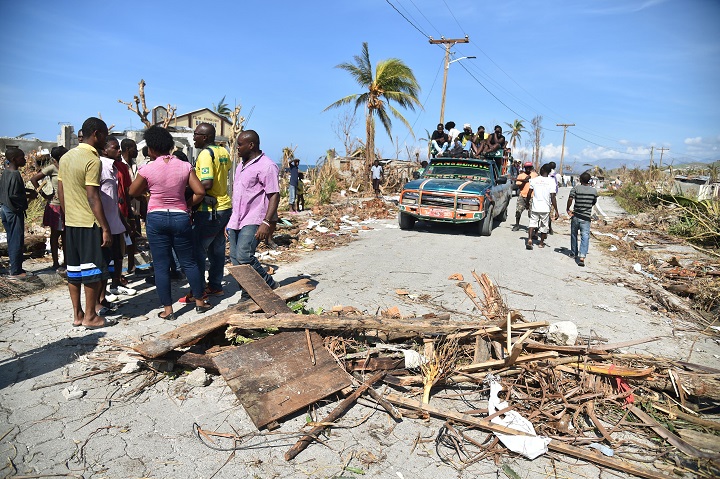 Residents block the road to protest, because they have not yet received help after Hurricane Matthew devasted the area, in the commune of Cotaux, in Les Cayes, in the southwest of Haiti, on October 11, 2016.
Haiti faces a humanitarian crisis that requires a "massive response" from the international community, the United Nations chief said Monday, with at least 1.4 million people needing emergency aid following last week's battering by Hurricane Matthew. The storm left at least 372 dead in the impoverished Caribbean nation, with the toll likely to rise sharply as rescue workers reach previously inaccessible areas.

 / AFP / HECTOR RETAMAL        (Photo credit should read .