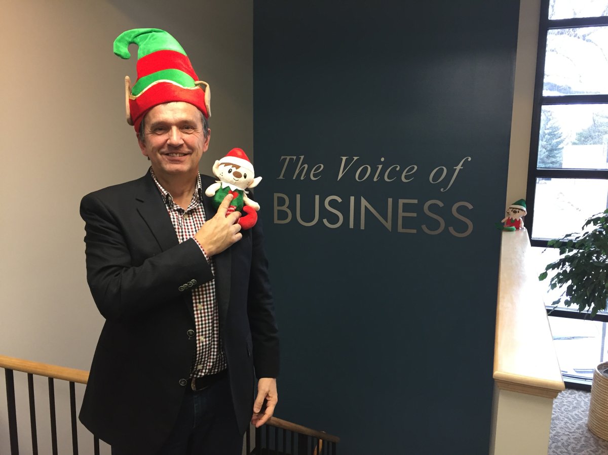 Harry Gross snaps a selfie with an elf to encourage shoppers to shop local in Lethbridge.
