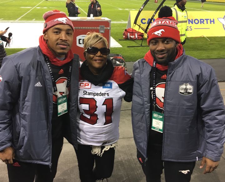 Renee Hill on the sidelines at the 104th Grey Cup. (Osagie Odiase right, Jamal Nixon left)
