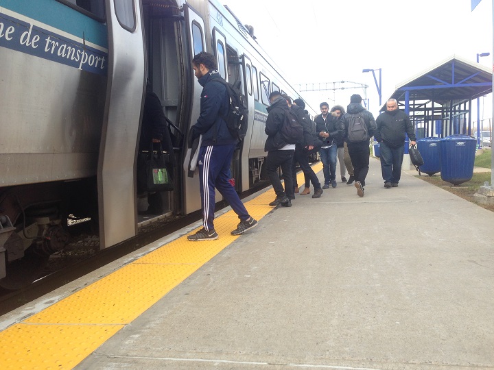 Riders taking the AMT train at the Roxboro-Pierrefonds station