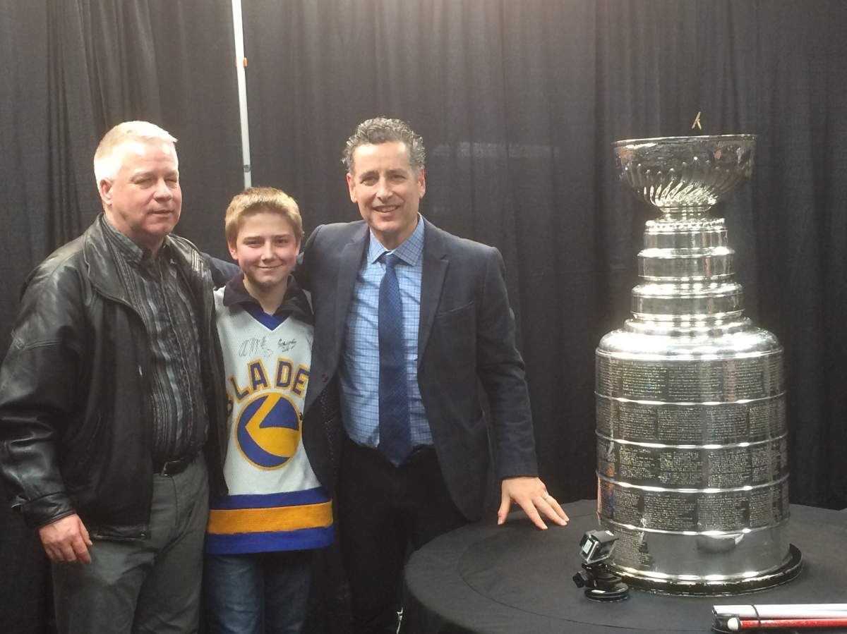 Gerry Nelson, Wyatt Nelson, and Saskatoon Blades President Steve Hogle at SaskTel Centre.