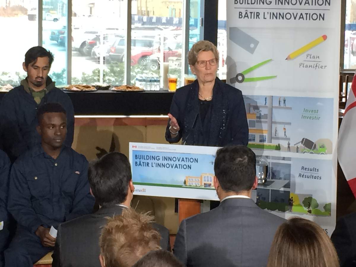 Premier Kathleen Wynne makes an announcement at Downsview in Toronto on Nov. 21, 2016.