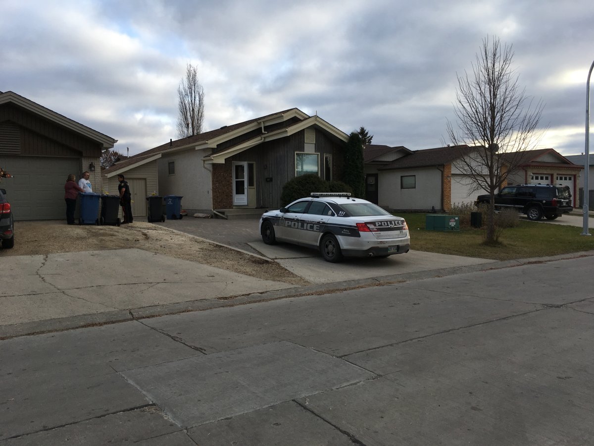 A police cruiser sits outside a home on Pinetree Crescent after a man was shot.
