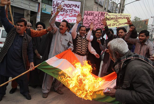 Protesters torch an Indian flag in the city of Multan in Pakistan on Nov. 23, 2016. 
