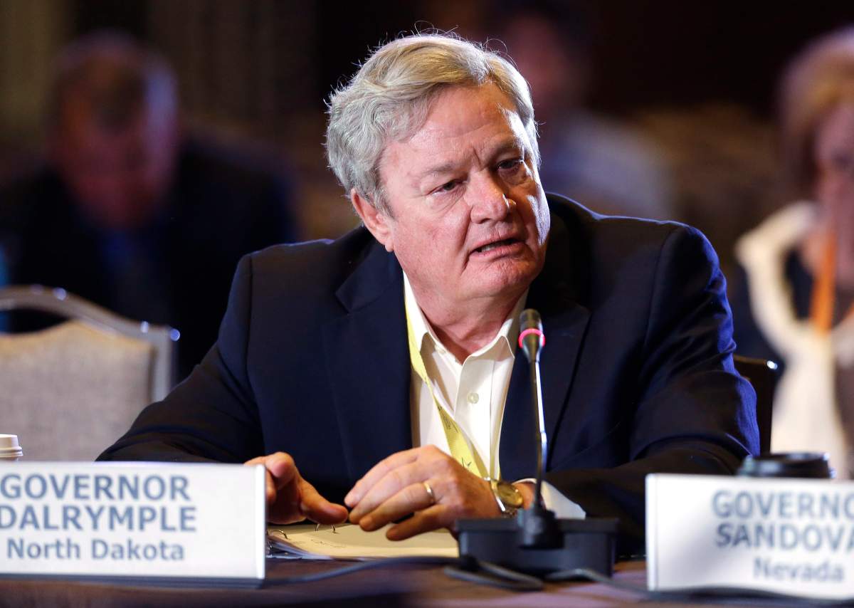 North Dakota Gov. Jack Dalrymple asks a question during a meeting of the Health and Human Services Committee at the National Governors Association convention on Saturday, July 12, 2014, in Nashville, Tenn.