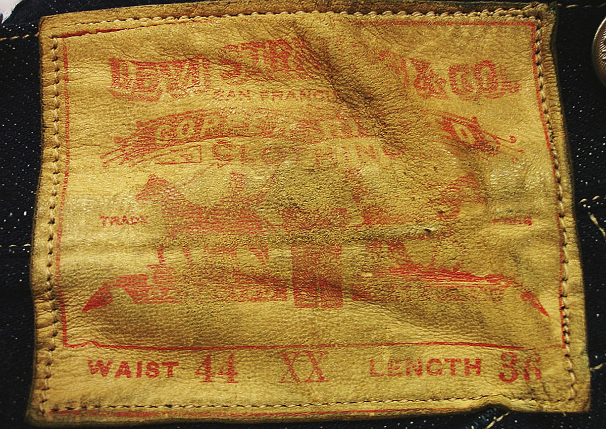 This undated photo provided by Daniel Buck Auctions & Appraisals shows a leather label on a pair of 1893 Levi-Strauss denim blue jeans in pristine condition that will go up for auction Saturday, Nov. 5, 2016 in Lisbon Falls, Maine.