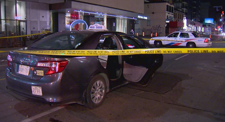 Toronto police blocked off part of the shooting scene near King Street West and John Street early Saturday.