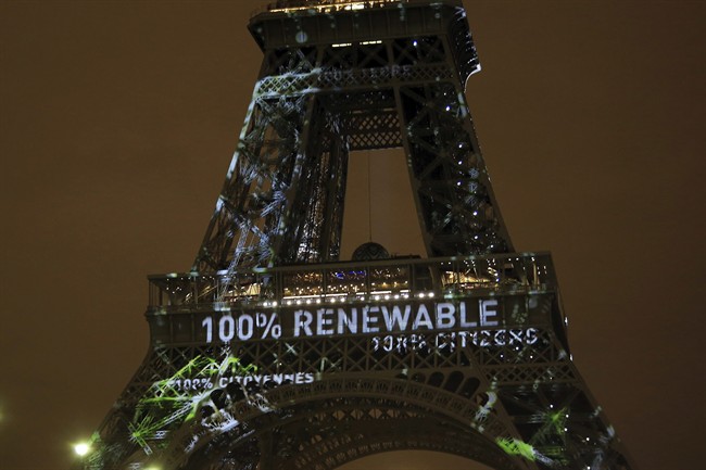 An artwork titled 'One Heart One Tree' is displayed on the Eiffel Tower ahead of the 2015 Paris Climate Conference in this Nov. 29, 2015 file photo.