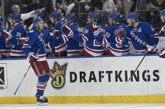 New York Rangers center Kevin Hayes (13) celebrates his goal with his teammates during the first period of an NHL hockey game against the Edmonton Oilers, Thursday, Nov. 3, 2016, at Madison Square Garden in New York. 