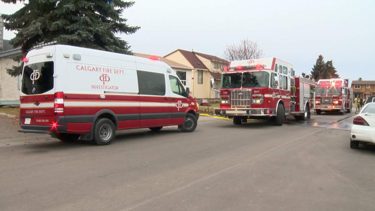 Fire crews at the scene of a house fire in Calgary's northeast Saturday. 