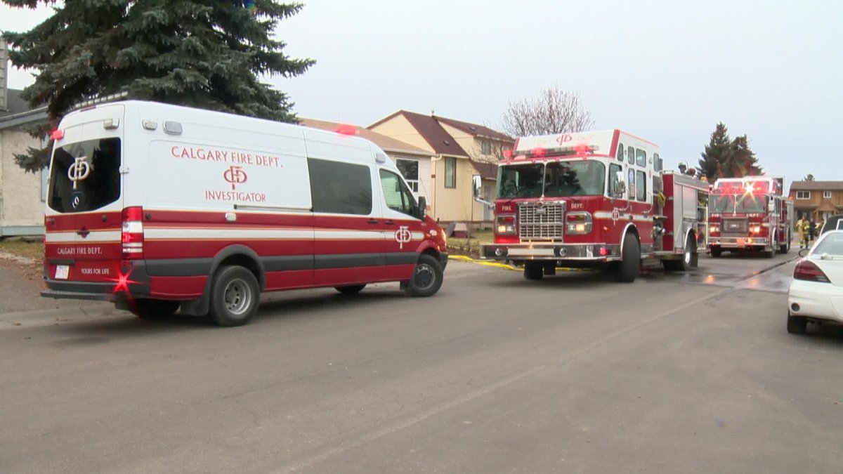 Fire crews at the scene of a house fire in Calgary's northeast Saturday. 
