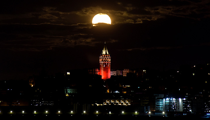 The supermoon is seen over the historical Galata Tower in Istanbul, Turkey, early November 14, 2016.