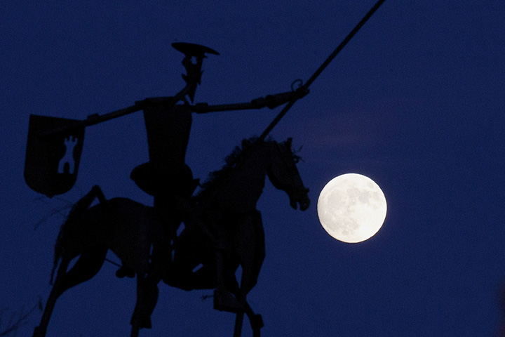 The moon rises behind a sculpture of Don Quixote De La Mancha on November 13, 2016 in Munera, near Albacete, Spain.
