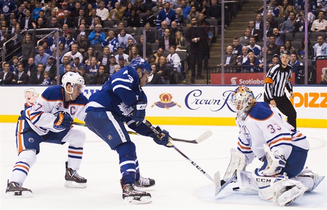 Toronto Maple Leafs centre Nazem Kadri (43) scores the winning goal past Edmonton Oilers goalie Cam Talbot (33) as Oilers centre Connor McDavid (97) looks on during overtime NHL hockey action in Toronto on Tuesday, November 1, 2016.