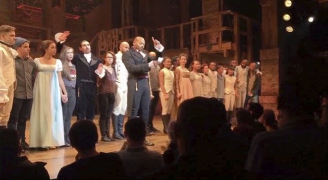 Actor Brandon Victor Dixon speaks from the stage to vice-president-elect Mike Pence after the curtain call in New York,Nov. 18, 2016.
